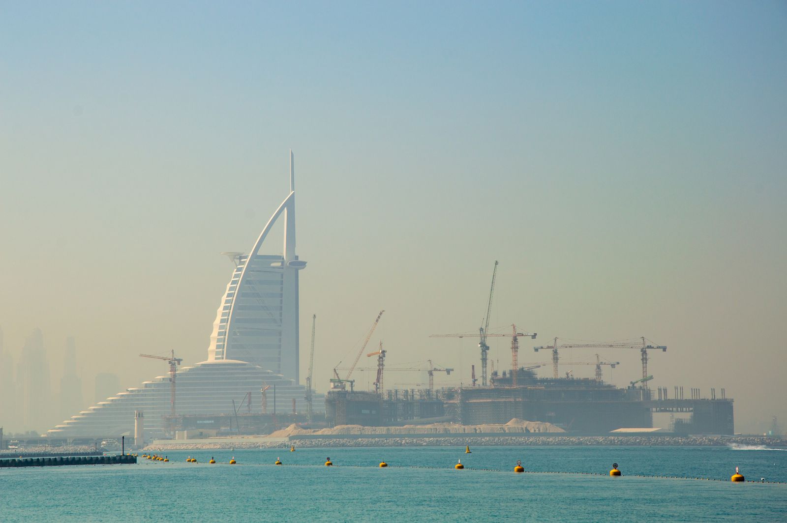Photo: Vika Glitter / Pexels Construction cranes at work on a Dubai development
