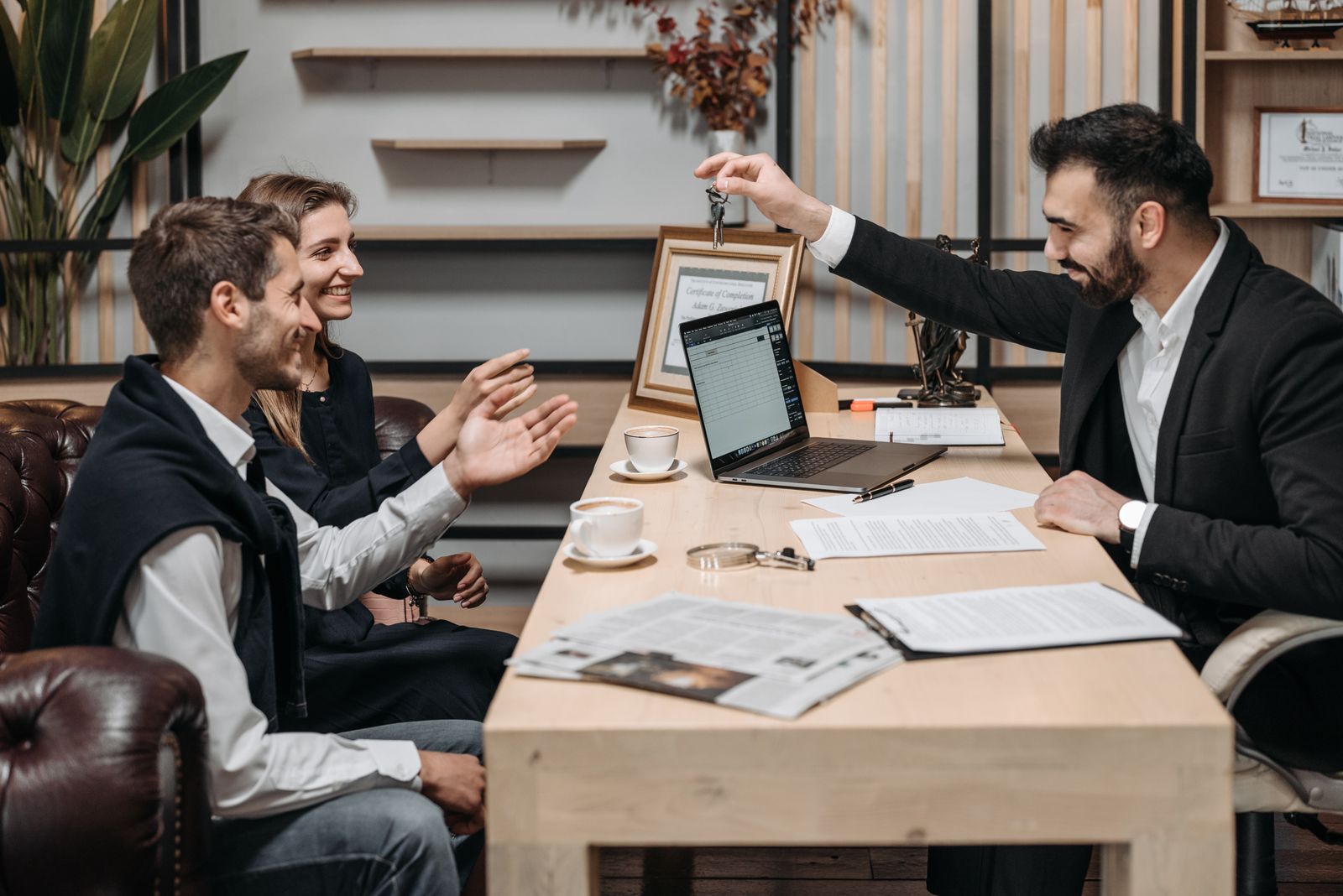 Photo: Pavel Danilyuk / Pexels A property professional handing over keys to buyers
